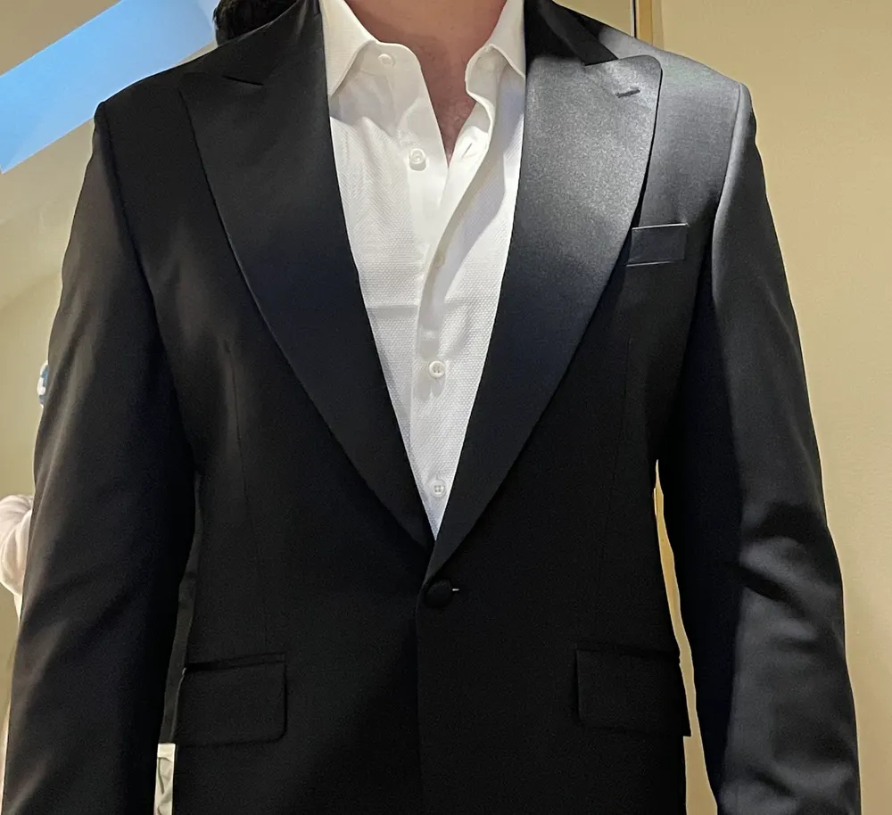Custom black tuxedo jacket with satin lapels